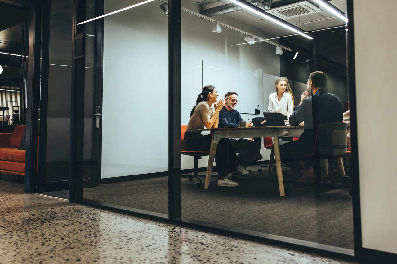 Business-colleagues-having-a-meeting-in-a-boardroom